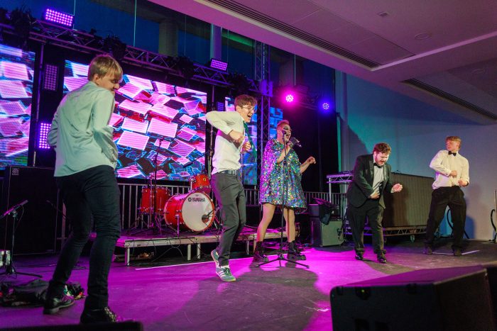 A drag performance with 4 male students in a dance competition.